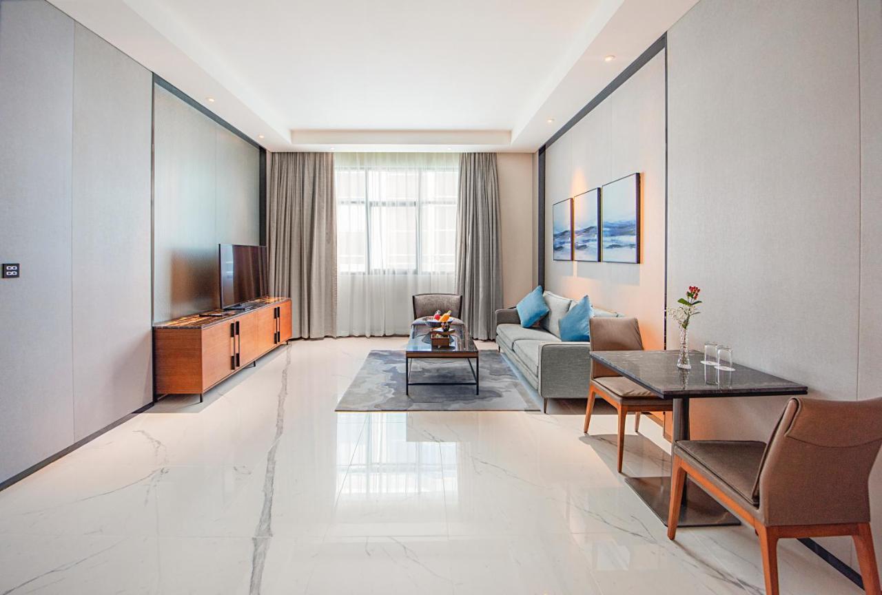 Asiana Grand Hotel Дубай Экстерьер фото A living room in a serviced apartment in Beijing, China