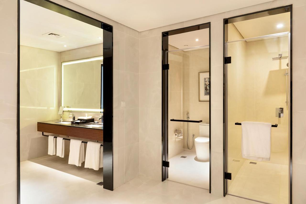 Asiana Grand Hotel Дубай Экстерьер фото A bathroom with a shower room
